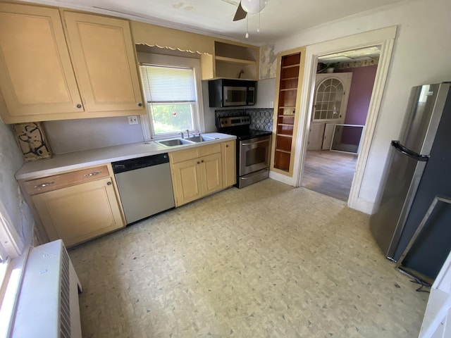 147 Spring St, Westbrook, ME 04092 - kitchen with appliances with stainless steel finishes, a sink, light flooring, light countertops, and a ceiling fan