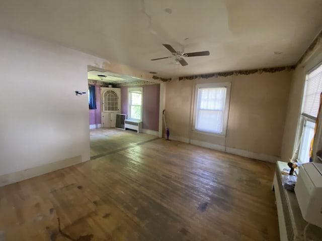 147 Spring St, Westbrook, ME 04092 - unfurnished room featuring ceiling fan, wood finished floors, baseboards, and plenty of natural light