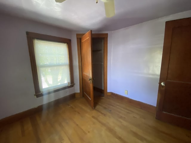 147 Spring St, Westbrook, ME 04092 - unfurnished bedroom with light wood-type flooring, baseboards, and a closet
