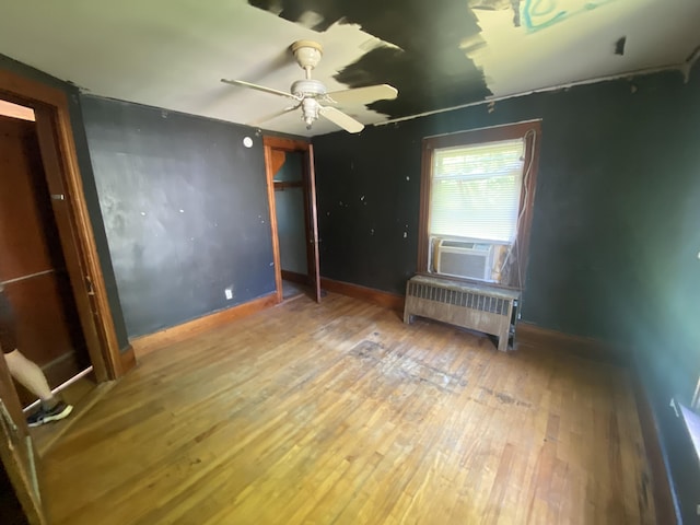 147 Spring St, Westbrook, ME 04092 - unfurnished room featuring radiator, ceiling fan, hardwood / wood-style floors, and baseboards