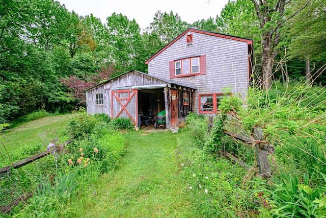 115 Wards Hill Rd, Baldwin, ME 04091 - rear view of house with a lawn and a storage unit