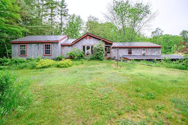 115 Wards Hill Rd, Baldwin, ME 04091 - rear view of house featuring a metal roof, a standing seam roof, and a lawn