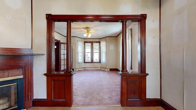 143 Union Ave, Old Orchard Beach, ME 04064 - unfurnished living room with carpet flooring, a glass covered fireplace, a ceiling fan, and baseboard heating