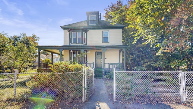 143 Union Ave, Old Orchard Beach, ME 04064 - view of front of property featuring covered porch, a fenced front yard, and a gate
