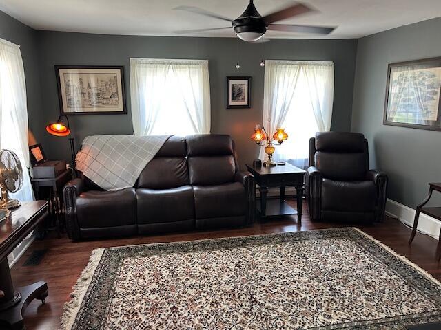 48 Allen St, Bangor, ME 04401 - living room featuring healthy amount of natural light, a ceiling fan, and wood finished floors