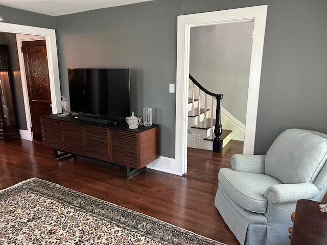 48 Allen St, Bangor, ME 04401 - living area featuring wood finished floors, stairs, and baseboards