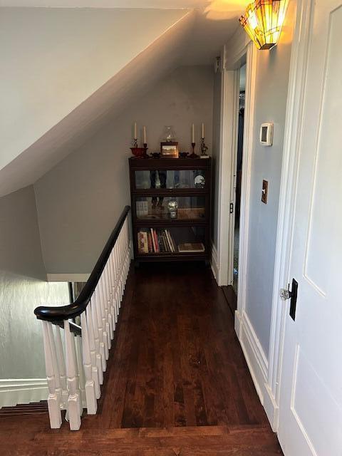 48 Allen St, Bangor, ME 04401 - hall featuring vaulted ceiling, dark wood finished floors, and baseboards