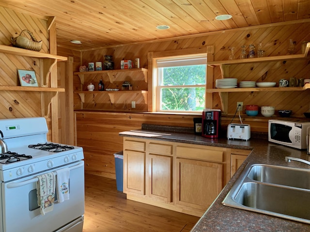 15 Snyder Rd, Eastport, ME 04631 - kitchen with white appliances, open shelves, a sink, wooden walls, and wood ceiling