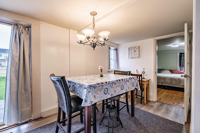 11 Stuart St, Saco, ME 04072 - dining space with wood finished floors and a chandelier
