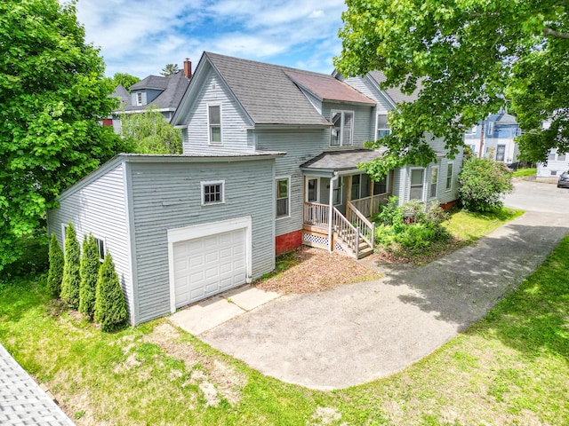 4 Heath St, Waterville, ME 04901 - view of front of property featuring driveway and a garage