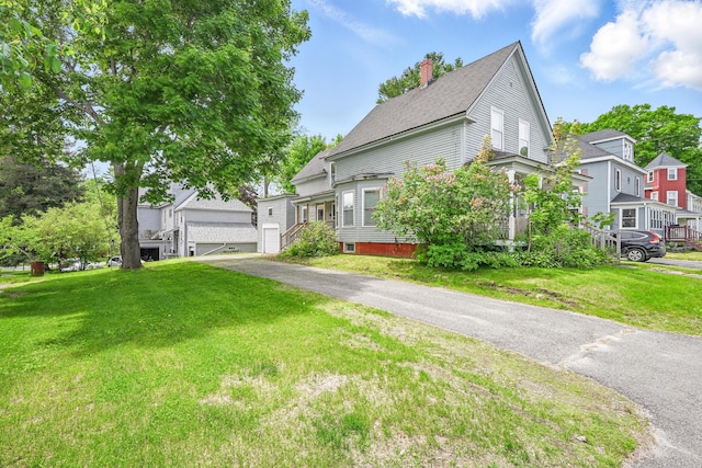 4 Heath St, Waterville, ME 04901 - view of front of home with a chimney, a front lawn, and a residential view