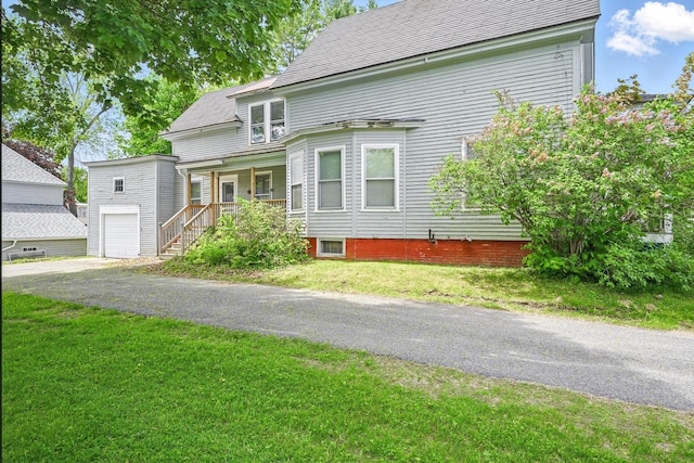 4 Heath St, Waterville, ME 04901 - view of front of home with covered porch, a front yard, and asphalt driveway