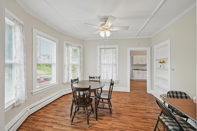 4 Heath St, Waterville, ME 04901 - dining room featuring a baseboard radiator, wood finished floors, ceiling fan, baseboards, and ornamental molding
