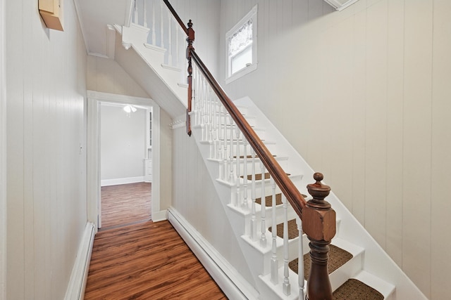 4 Heath St, Waterville, ME 04901 - stairway featuring wood finished floors, a baseboard radiator, and baseboards