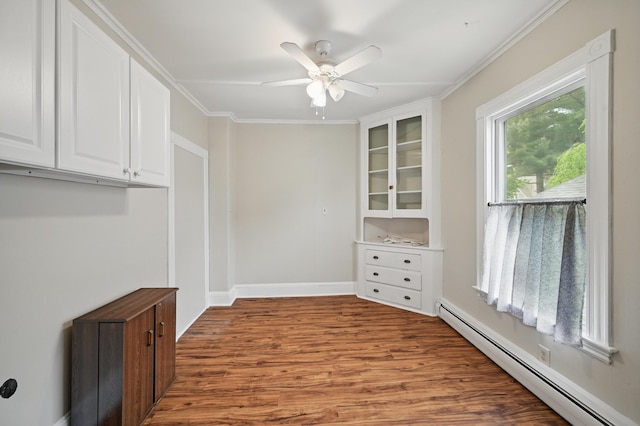 4 Heath St, Waterville, ME 04901 - empty room featuring baseboard heating, a ceiling fan, wood finished floors, ornamental molding, and baseboards