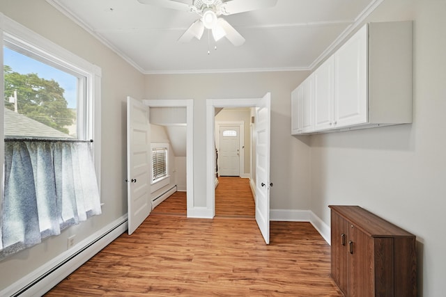 4 Heath St, Waterville, ME 04901 - laundry area with baseboard heating, light wood-style flooring, a ceiling fan, baseboards, and crown molding