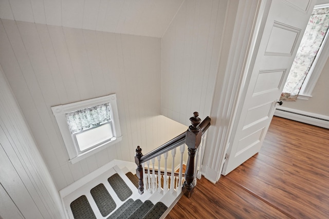 4 Heath St, Waterville, ME 04901 - staircase featuring wood finished floors, a baseboard radiator, and wood walls