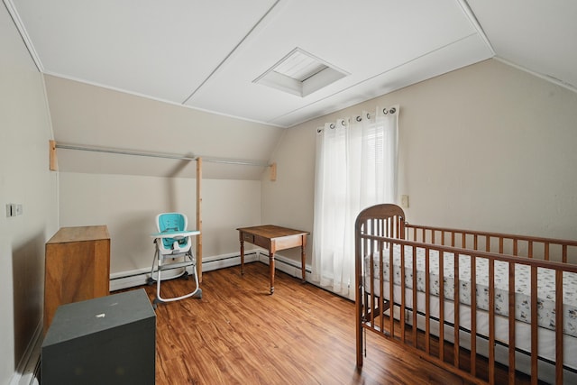 4 Heath St, Waterville, ME 04901 - bedroom featuring lofted ceiling, wood finished floors, and a baseboard heating unit