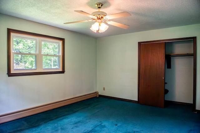 130 Davis Rd, Fairfield, ME 04937 - unfurnished bedroom featuring a baseboard heating unit, carpet floors, a textured ceiling, a closet, and ceiling fan