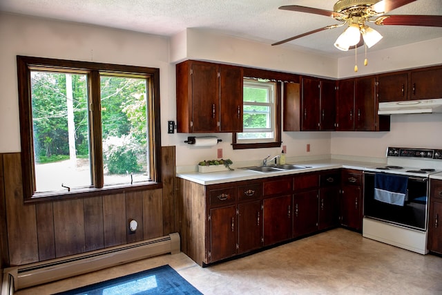 130 Davis Rd, Fairfield, ME 04937 - kitchen with range with electric cooktop, a baseboard radiator, under cabinet range hood, a sink, and light countertops
