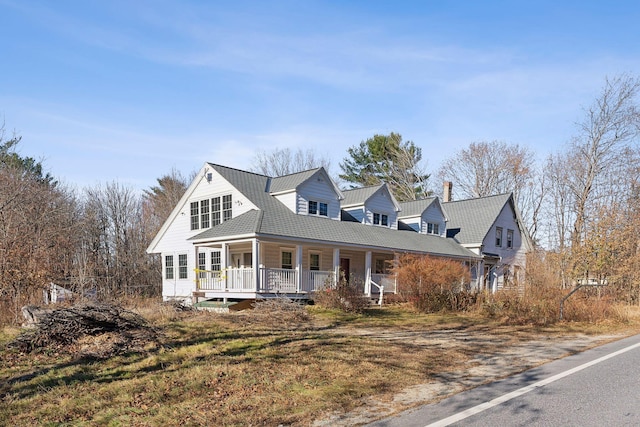 454 N Parish Rd, Turner, ME 04282 - view of front of home with a porch and a chimney