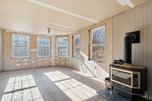 454 N Parish Rd, Turner, ME 04282 - unfurnished sunroom featuring plenty of natural light and a wood stove