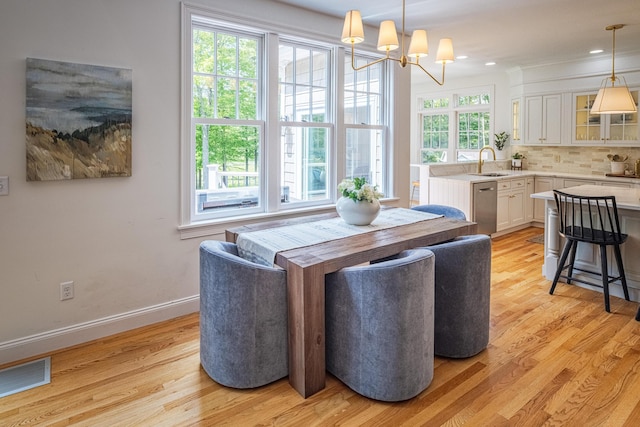 20 Doe Dr, Eliot, ME 03903 - dining space with light wood finished floors, a chandelier, baseboards, and recessed lighting