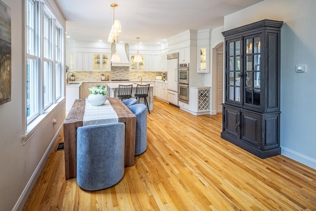 20 Doe Dr, Eliot, ME 03903 - dining area with baseboards and light wood finished floors