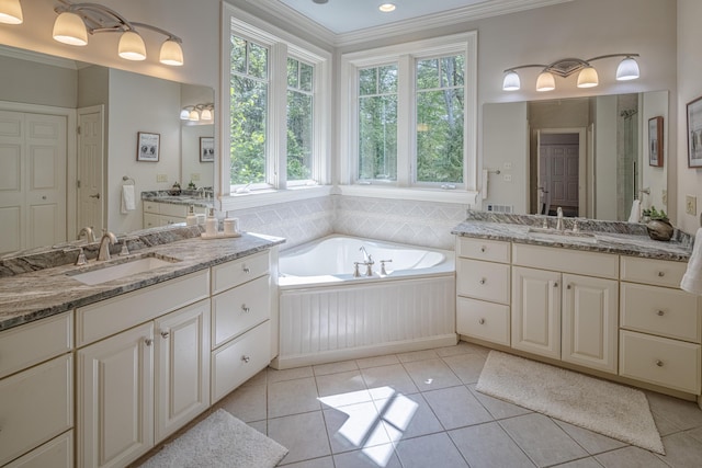 20 Doe Dr, Eliot, ME 03903 - full bath with crown molding, two vanities, a bath, tile patterned flooring, and a shower