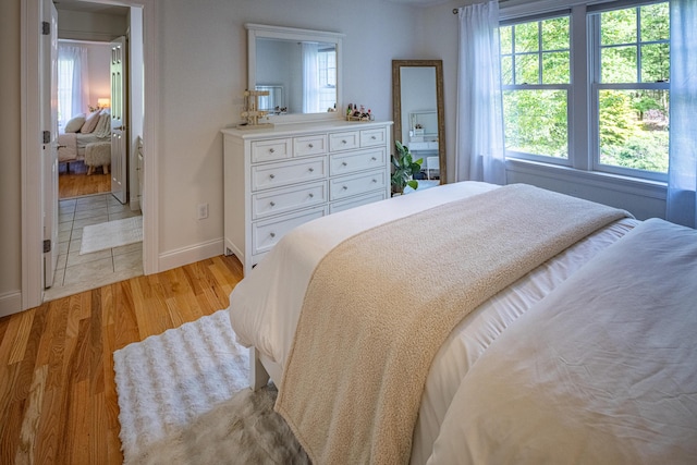 20 Doe Dr, Eliot, ME 03903 - bedroom featuring light wood-type flooring, multiple windows, and baseboards