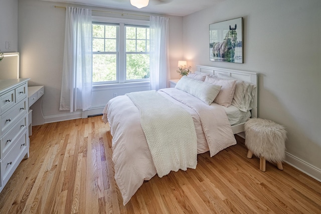 20 Doe Dr, Eliot, ME 03903 - bedroom featuring a baseboard heating unit, light wood-type flooring, and baseboards