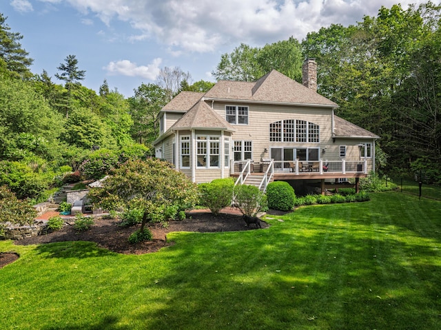 20 Doe Dr, Eliot, ME 03903 - back of house with a wooden deck, a chimney, a sunroom, stairway, and a yard