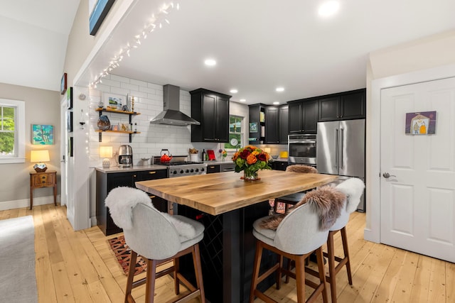 83 Brixham Rd, York, ME 03909 - kitchen featuring wall chimney range hood, high quality fridge, wooden counters, dark cabinetry, and open shelves