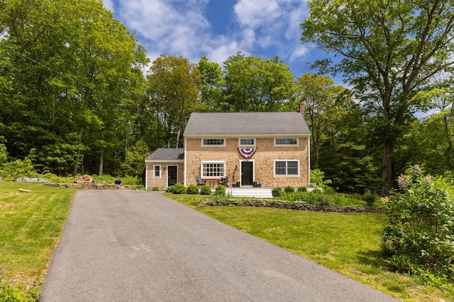 83 Brixham Rd, York, ME 03909 - shingle-style home with driveway, a chimney, a front lawn, and roof with shingles