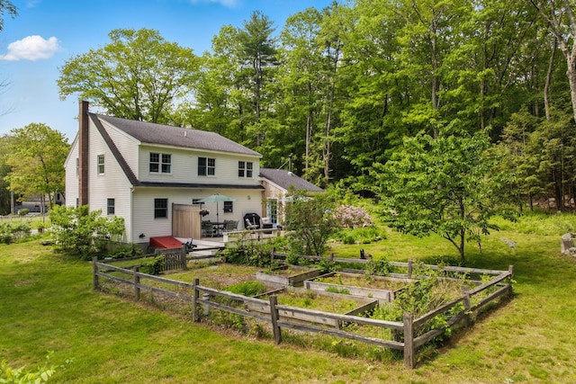 83 Brixham Rd, York, ME 03909 - rear view of property featuring a garden, a lawn, and a chimney