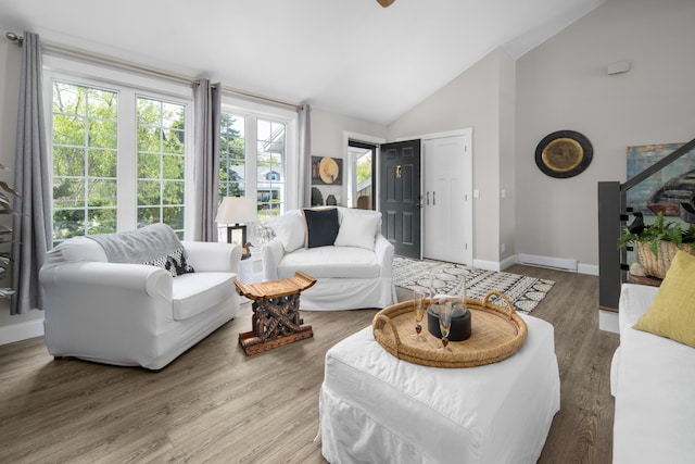 36 Bayberry Ave, Kennebunk, ME 04043 - living room featuring baseboards, wood finished floors, high vaulted ceiling, and a ceiling fan
