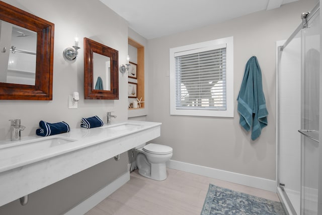 36 Bayberry Ave, Kennebunk, ME 04043 - full bath with a sink, baseboards, a shower stall, and toilet