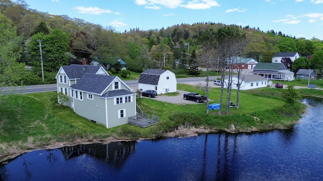 590 Main St, East Machias, ME 04630 - aerial view of property and surrounding area featuring a forest and a large body of water