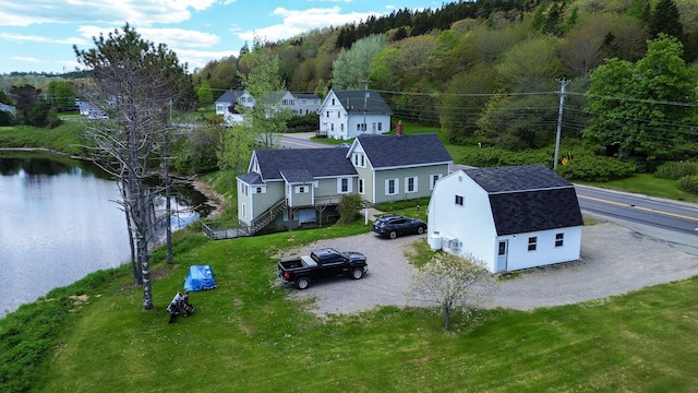 590 Main St, East Machias, ME 04630 - aerial view of property and surrounding area featuring a nearby body of water and a heavily wooded area