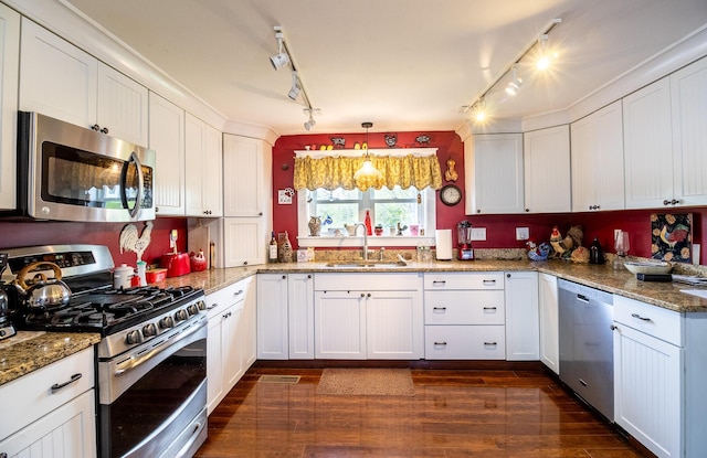 590 Main St, East Machias, ME 04630 - kitchen with stainless steel appliances, a sink, track lighting, and dark wood-style floors