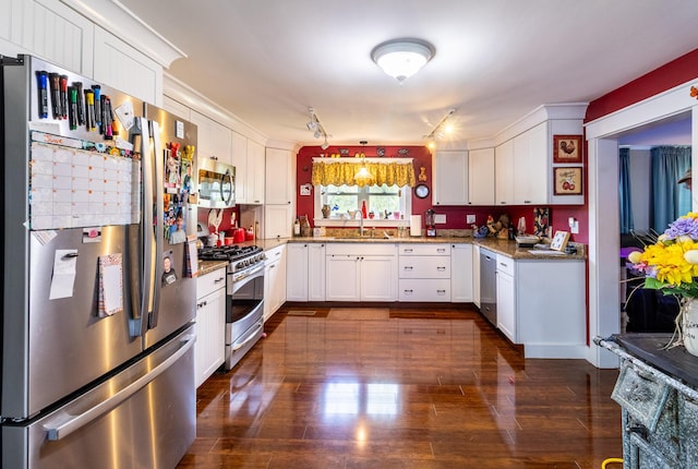 590 Main St, East Machias, ME 04630 - kitchen featuring stainless steel appliances, a sink, white cabinets, and light stone countertops