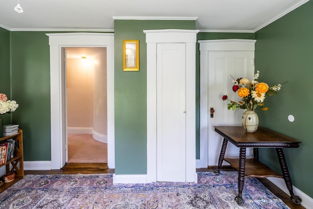 590 Main St, East Machias, ME 04630 - bedroom featuring baseboards, wood finished floors, crown molding, and a closet
