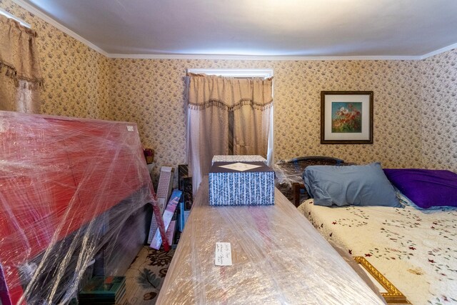 590 Main St, East Machias, ME 04630 - bedroom with ornamental molding and wallpapered walls