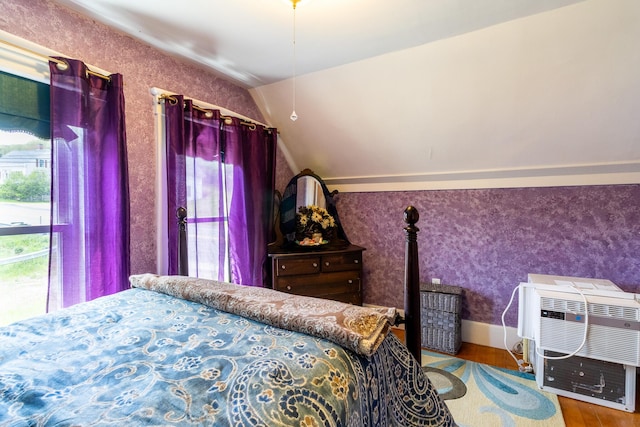 590 Main St, East Machias, ME 04630 - bedroom featuring vaulted ceiling, wood finished floors, and wallpapered walls
