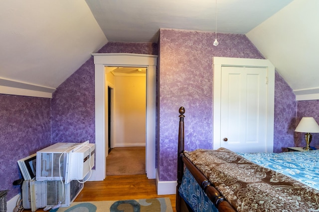 590 Main St, East Machias, ME 04630 - bedroom featuring wood finished floors, vaulted ceiling, and wallpapered walls