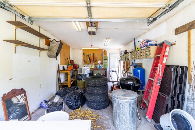 590 Main St, East Machias, ME 04630 - garage featuring a workshop area and a garage door opener