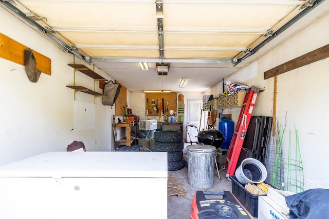 590 Main St, East Machias, ME 04630 - garage with freestanding refrigerator and a garage door opener