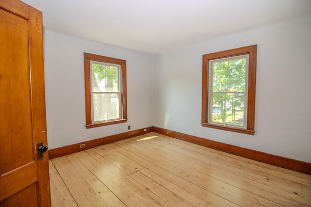12 Park Ave, Newport, ME 04953 - unfurnished room with plenty of natural light, baseboards, and light wood-style flooring