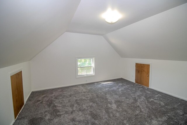 12 Park Ave, Newport, ME 04953 - additional living space with carpet floors, lofted ceiling, and baseboards