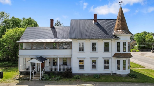 123 Main St, Newport, ME 04953 - rear view of property with a chimney, covered porch, and metal roof
